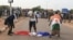 FILE - Protesters defile a French national flag during a rally in Niamey, Niger, Sept. 1, 2023, demanding the departure of French troops from Niger.
