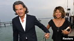 FILE - Singer Tina Turner, right, and her husband, Erwin Bach, arrive for the premiere of Giacomo Puccini's 'Tosca' at Lake Constance in Bregenz, Austria, July 19, 2007.
