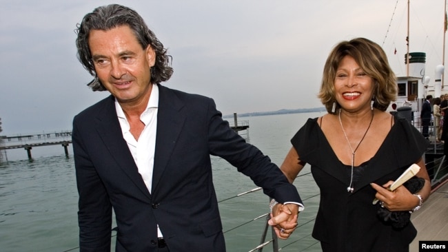 FILE - Singer Tina Turner, right, and her husband, Erwin Bach, arrive for the premiere of Giacomo Puccini's "Tosca" at Lake Constance in Bregenz, Austria, July 19, 2007.