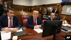Former President Donald Trump, flanked by his lawyers, appears in State Supreme Court in New York, April 15, 2024, for the first day of his trial on charges of falsifying business records. (Jefferson Siegel/Pool Photo via AP)

