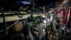 Ukrainian paratroopers of 80 Air Assault brigade rest inside a dugout at the front line near Bakhmut, Ukraine, March 10, 2023.