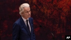 FILE - Populist Dutch anti-Islam lawmaker Geert Wilders reacts during a debate in parliament in The Hague, Netherlands, April 2, 2021.