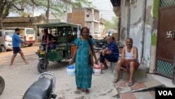 Kamlesh Devi says elderly residents like her cannot cope with the elbowing and pushing that ensues when water trucks arrive. (Anjana Pasricha/VOA)
