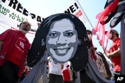 Protesters gather for a march to the Democratic National Convention, Aug. 19, 2024, in Chicago.