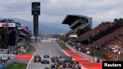 Red Bull&#39;s Max Verstappen, McLaren&#39;s Lando Norris and Mercedes&#39; George Russell lead the Formula 1 Spanish Grand Prix at the Barcelona Catalunya racetrack in Montmelo, near Barcelona, Spain.