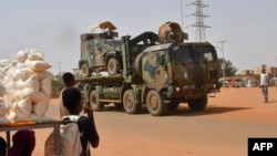 FILE - A French Army vehicle moves through Niamey, Niger, on Oct. 10, 2023, to a destination that could be Chad, according to security sources. Opposition and civil society groups in Chad are asking France to remove troops already stationed in Chad and those arriving from Niger.