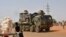 A French Army military vehicle belonging to a convoy of French troops is seen crossing the Lazaret district in Niamey, Niger, Oct. 10, 2023.