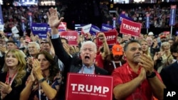 Florida delegate Rick Roth, center, reacts during the Republican National Convention in Milwaukee, July 15, 2024.