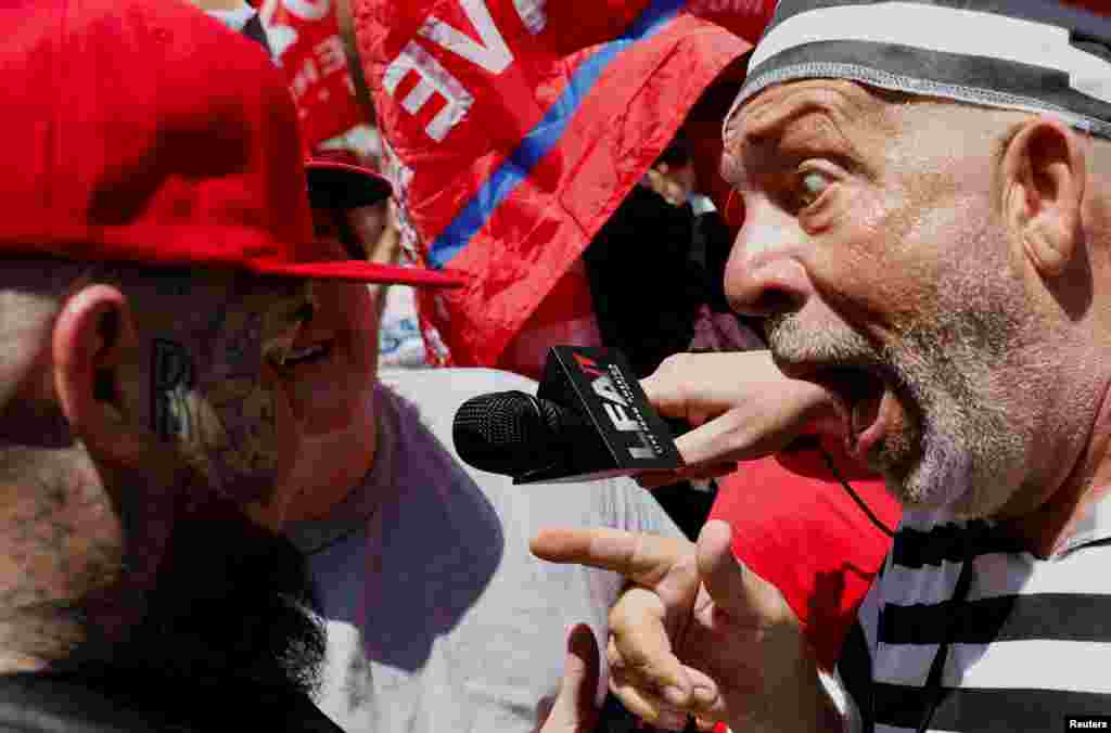 A supporter of former President Donald Trump and an anti-Trump demonstrator argue near the Wilkie D. Ferguson Jr. U.S. Courthouse where Trump is to appear at his arraignment on classified document charges, in Miami, Florida.