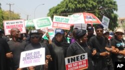 FILE: Supporters of Atiku Abubakar of the People's Democratic Party, attend a protest against the recent presidential election results, in Abuja, Nigeria, March 6, 2023.