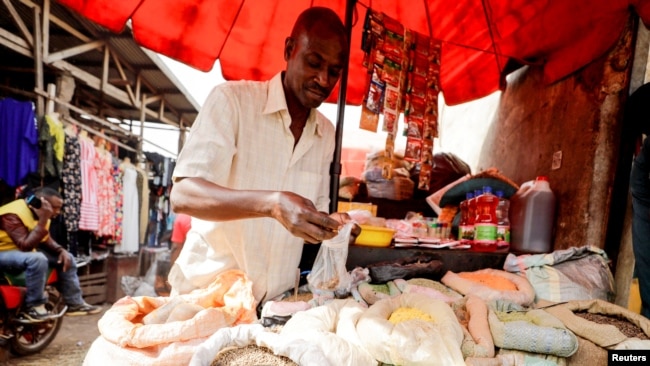 FILE - A vendor is seen in the Mvog Ada market in Yaounde, Cameroon, Jan. 29, 2022.