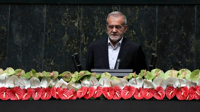 Iran's new president sworn in, pledges to keep trying to remove Western sanctions 