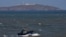 A Chinese fishing boat sails across the Taiwan Strait near the Taiwan-controlled Niushan Island, off Pingtan Island, Fujian province, China, April 9, 2023.
