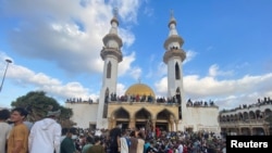 Demonstrators take part in protest outside of the Al Sahaba Mosque against the government, in the aftermath of the floods in Derna, Libya, Sept. 18, 2023. 