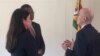 Visiting American envoy Ambassador Scott speaking with a Zimbabwean official and a U.S. staffer. (VOA)