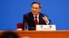 资料照：中国总理李强在北京人大会堂参加全国人大闭幕式后在记者会上讲话。（2023年3月13日）