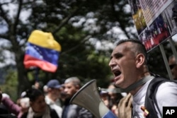 Demonstrators protest Venezuela's contested presidential election results outside Venezuela's consulate in Bogota, Colombia, Aug. 1, 2024.