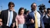 Amanda Knox arrives flanked by her husband Christopher Robinson, right, and her lawyer Luca Luparia Donati at the Florence courtroom in Florence, Italy, June 5, 2024.