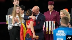 FILE - President of Spain's soccer federation, Luis Rubiales, right, hugs Spain's Aitana Bonmati on the podium following Spain's win in the final of Women's World Cup soccer against England at Stadium Australia in Sydney, Australia, Aug. 20, 2023. 
