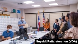Officers sort received overseas absentee ballots, preparing to pack in diplomatic pouches and send them back to count in Thailand at the Royal Thai Consulate-General of Los Angeles, CA.