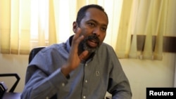 FILE - Former cabinet minister Khalid Omer Yousif, the official spokesperson of the civilian coalition that signed the agreement, speaks during an interview with Reuters in Khartoum, Sudan January 31, 2022.