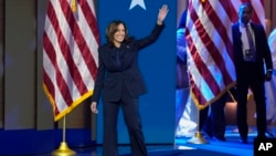 Democratic presidential nominee Vice President Kamala Harris walks on stage to speak during the Democratic National Convention, Aug. 22, 2024, in Chicago.