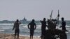 A ship belonging to the Open Arms aid group approaches the shores of Gaza towing a barge with 200 tons of humanitarian aid, March 15, 2024. The ship set sail Tuesday from Cyprus to inaugurate a sea route to get aid into the war-wracked enclave.