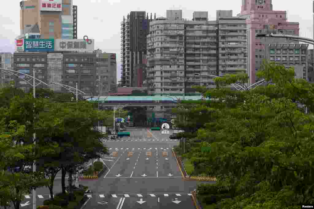 A view shows an empty road as people participate in the annual air-raid exercise, where they are ordered to stay indoors for 30 minutes in Taipei, Taiwan. REUTERS/Ann Wang
