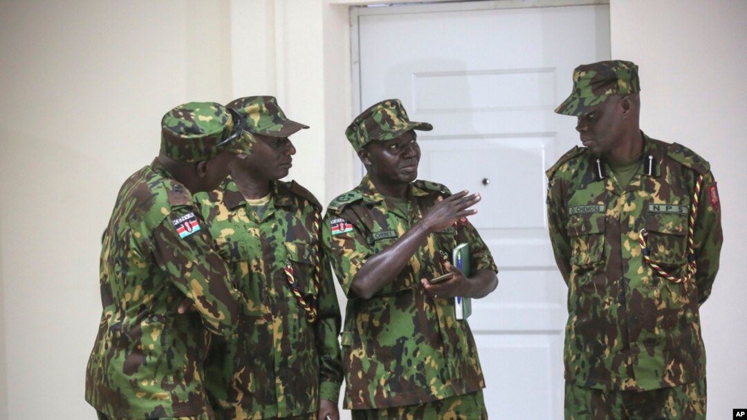 Members of a U.N.-backed Kenyan force stand at police headquarters ahead of a press conference in Port-au-Prince, Haiti, July 8, 2024.