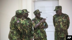 Members of a U.N.-backed force led by Kenya stand at police headquarters ahead of a press conference in Port-au-Prince, Haiti, July 8, 2024.