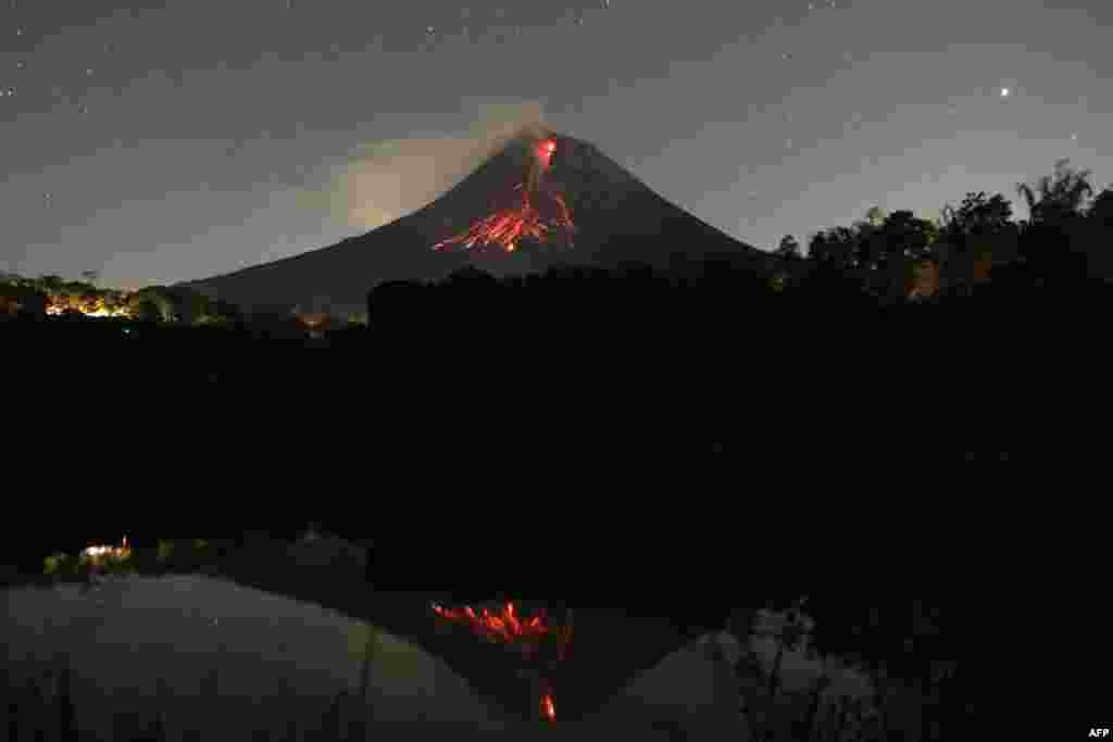 A long exposure photo shows Mount Merapi volcano releasing hot lava at the Srumbung village in Magelang, Central Java, Indonesia.