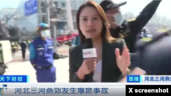 Chinese security personnel interrupt a CCTV reporter during a live report near the scene of the Hebei blast on March 13, 2024. Shortly afterward, security personnel blocked the video camera and the live feed was cut off. (Screen grab from CCTV)