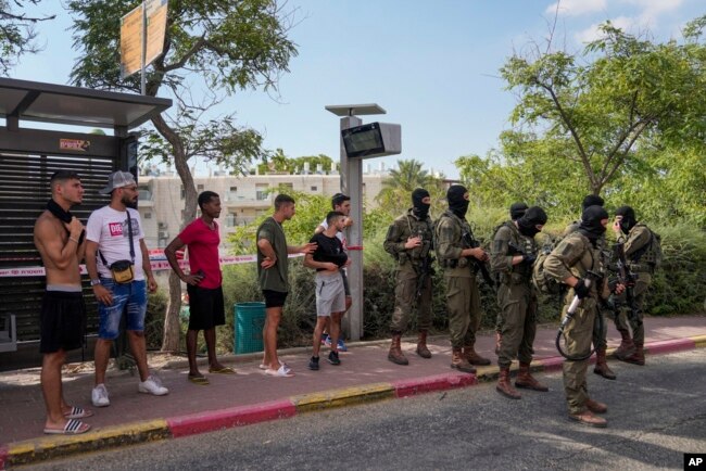 Israeli security forces are seen deployed at the site of a shooting attack in the West Bank Israeli settlement of Ma'ale Adumim, Aug 1, 2023.