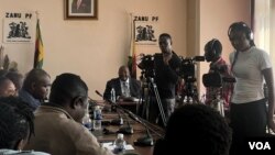 Journalists are seen gathered at Zanu-PF offices this week in Harare, Zimbabwe. (Columbus Mavhunga/VOA)