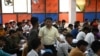 Maroof Ahmed, a maths instructor and Super Climax Academy founder, interacts with students inside a class at Super Climax Academy, a popular coaching institute training students to secure government jobs, in Prayagraj, India, June 21, 2024. 