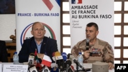 FILE - Luc Hallade (L), French Ambassador to Burkina Faso and General Laurent Michon (R), Commander of Barkhane Force, at a press conference in Ouagadougou on July 21, 2022. 
