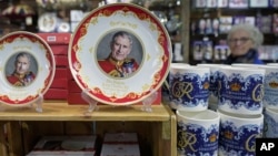 Coronation plates and mugs are displayed for sale in a gift shop in London, April 24, 2023. 