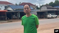 This photo made available by a source wishing to remain anonymous shows Chinese rights lawyer Lu Siwei on a road at an undisclosed location around 300 kilometers (186 miles) north of Vientiane, Laos, on July 27, 2023.