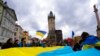 People gather at the Old Town Square to mark the first anniversary of Russia's full-scale invasion of Ukraine, downtown Prague, Czech Republic, Feb. 24, 2023.