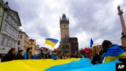 People gather at the Old Town Square to mark the first anniversary of Russia's full-scale invasion of Ukraine, downtown Prague, Czech Republic, Feb. 24, 2023.