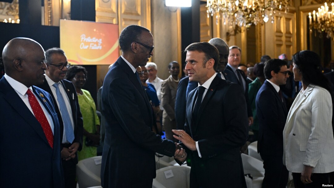 French President Emmanuel Macron, right, welcomes Rwanda's President Paul Kagame to the Global Forum for Vaccine Sovereignty and Innovation at the French Foreign Ministry in Paris, June 20, 2024. Macron and African leaders are working to make vaccines more available in Africa.