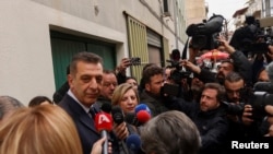 Lawyer Stefanos Pantzartzidis, who represents the station master being investigated over fatal collision of two trains, speaks to journalists outside the courthouse in the city of Larissa, Greece, March 4, 2023.