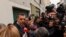 Lawyer Stefanos Pantzartzidis, who represents the station master being investigated over fatal collision of two trains, speaks to journalists outside the courthouse in the city of Larissa, Greece, March 4, 2023.