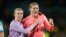 England's goalkeeper Mary Earps, right, and Jordan Nobbs celebrate as they won the Women's World Cup semifinal soccer match between Australia and England at Stadium Australia in Sydney, Australia, Aug. 16, 2023. 