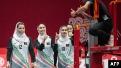Afghanistan's players gesture during a volleyball preliminary match between Afghanistan and Kazakhstan at the Asian Games in Hangzhou, in China's eastern Zhejiang province, Sept. 30, 2023. 