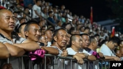 This photo taken July 30, 2023, shows spectators watching a game for third place in the grassroots basketball competition CunBA in Taipan village, Taijiang county, in southwestern China's Guizhou province.