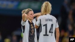 Germany's Svenja Huth, left, and Lena Lattwein react following the Women's World Cup Group H soccer match between South Korea and Germany in Brisbane, Australia, Aug. 3, 2023. 