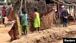 (FILE) Displaced Sudanese children stand at Zamzam camp, in North Darfur, Sudan, Aug. 1, 2024. 