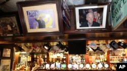Pictures of President Joe Biden, right and former President Bill Clinton hang in Fitzpatrick's pub, near Dundalk, Ireland, April, 5, 2023.