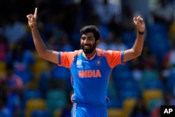 India's Jasprit Bumrah celebrates the dismissal of Afghanistan's Najibullah Zadran during the ICC Men's T20 World Cup cricket match between Afghanistan and India at Kensington Oval in Bridgetown, Barbados, June 20, 2024.
